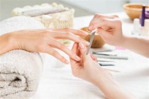 Manicure nail filing take off and shaping at Holt Nail Salon